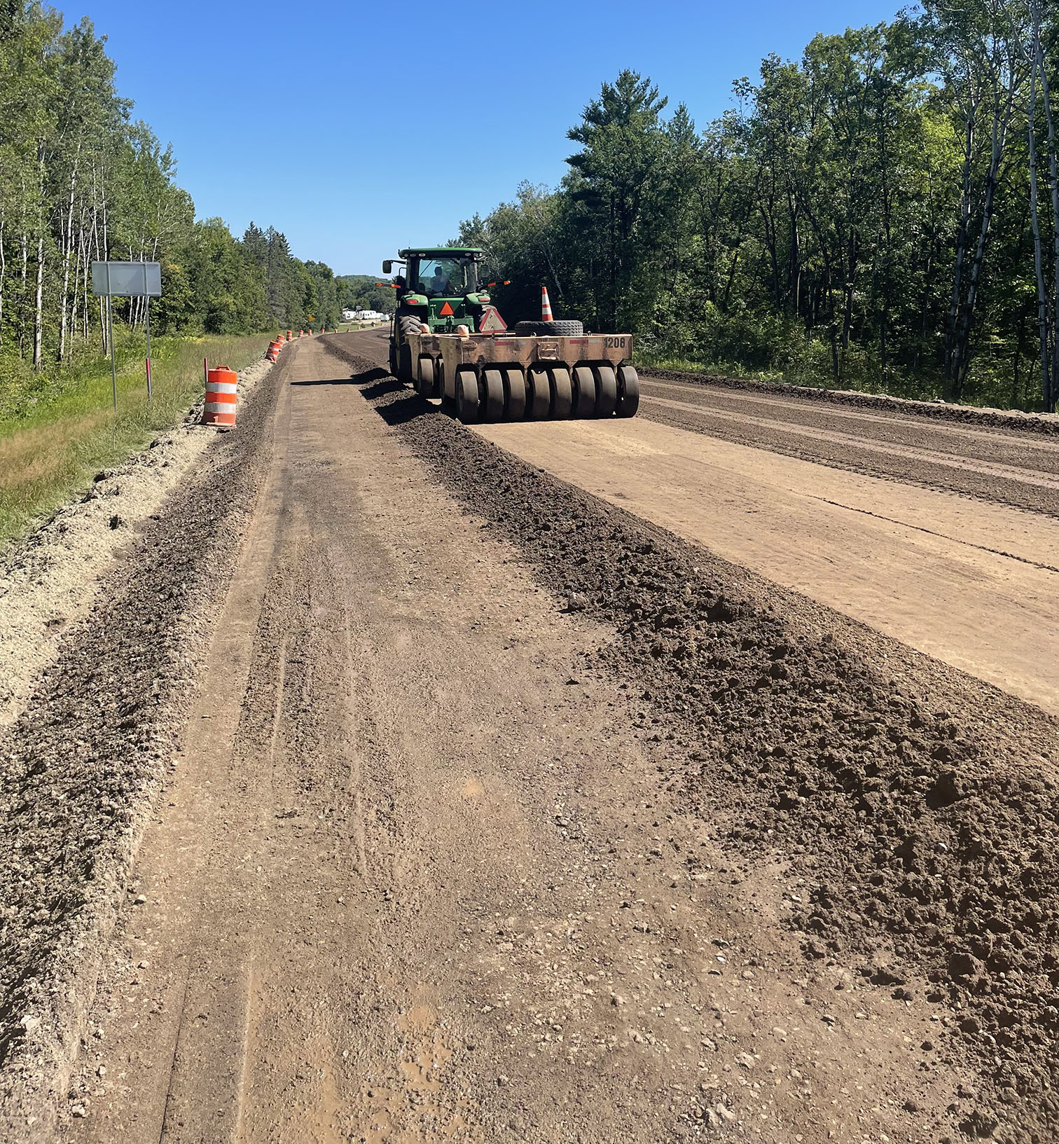 csi crew works on gravel road